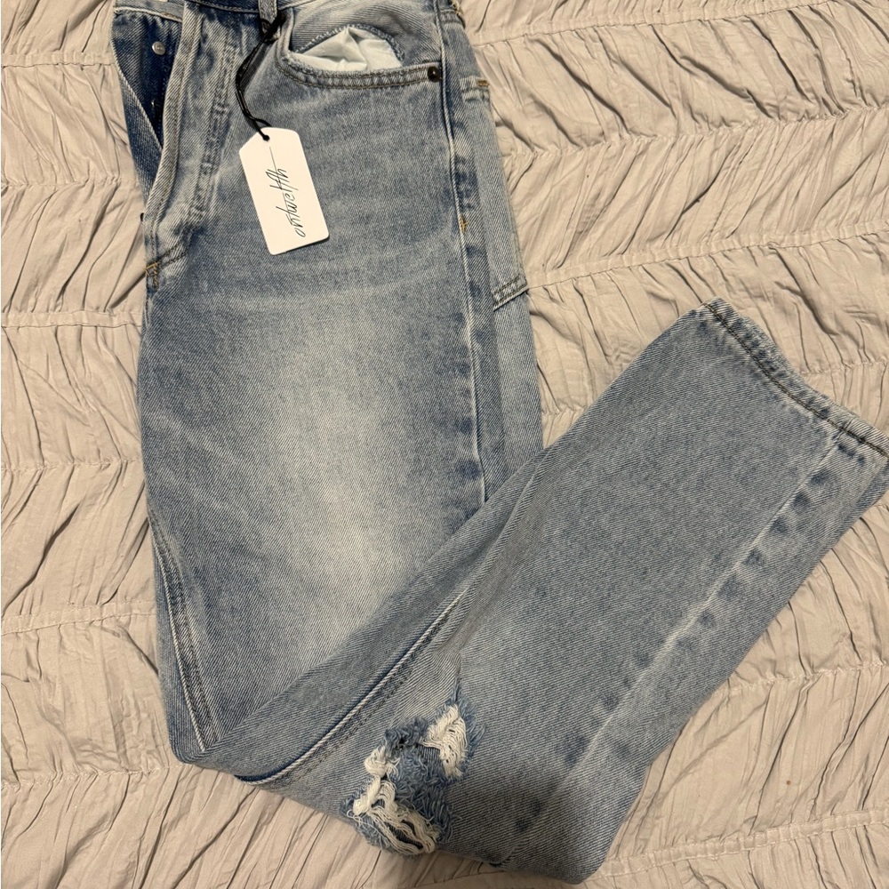 Distressed Light Wash Denim Jeans